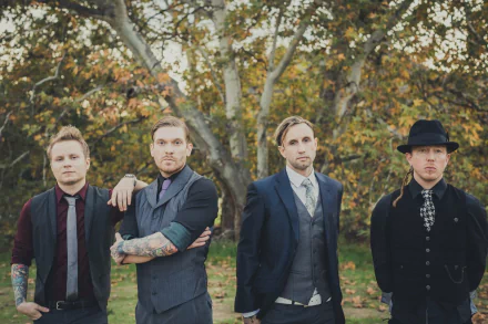 HD desktop wallpaper of Shinedown, featuring the band members standing outdoors with autumn foliage in the background.