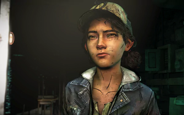 Clementine from The Walking Dead: The Final Season—close-up portrait with dirt and bruises, wearing her cap and jacket in moody lighting; HD PC desktop wallpaper/background, video game art.