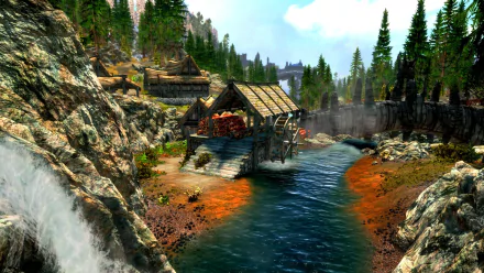 HD PC desktop wallpaper from The Elder Scrolls V: Skyrim featuring a rustic watermill by a river flowing through a forested mountainous landscape.