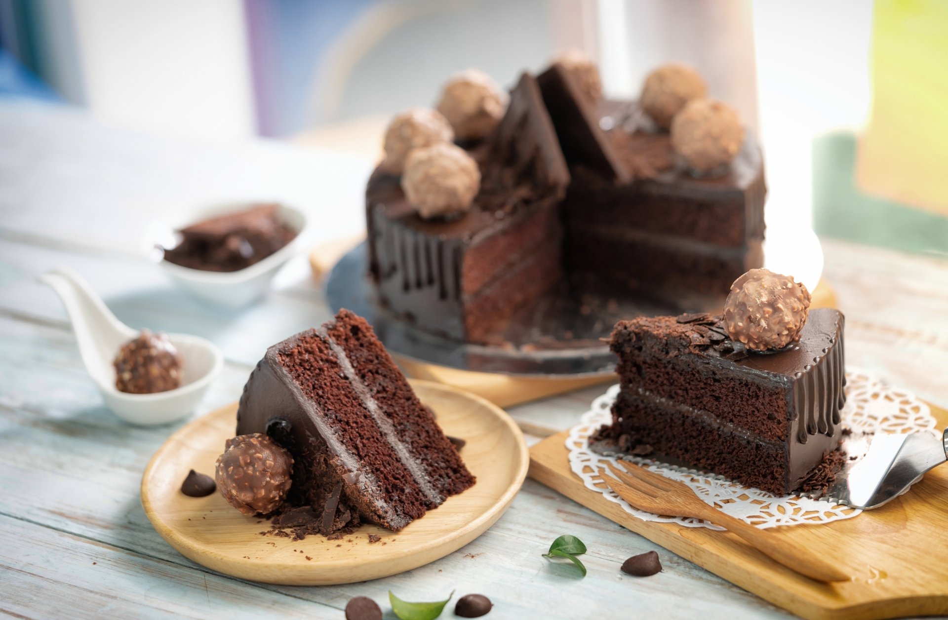 Rich chocolate cake with layered pastry and truffle decorations in a still life setup, captured in 8K Ultra HD for a PC desktop wallpaper and background.