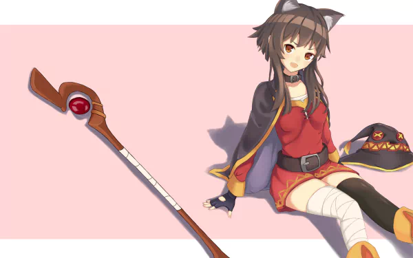 Anime character Megumin from KonoSuba with cat ears (nekomimi) sitting with her hat and staff on a pink background. This high-definition desktop wallpaper and background is tagged with KonoSuba and God’s blessing on this wonderful world!!
