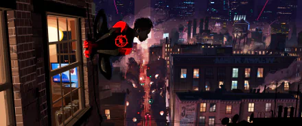 Miles Morales as Spider-Man clings to a building in New York City at night in this HD desktop wallpaper from Spider-Man: Into The Spider-Verse.