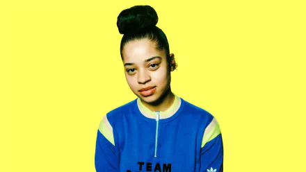 HD desktop wallpaper featuring Ella Mai against a vibrant yellow background.