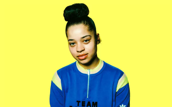 HD desktop wallpaper featuring Ella Mai against a vibrant yellow background.