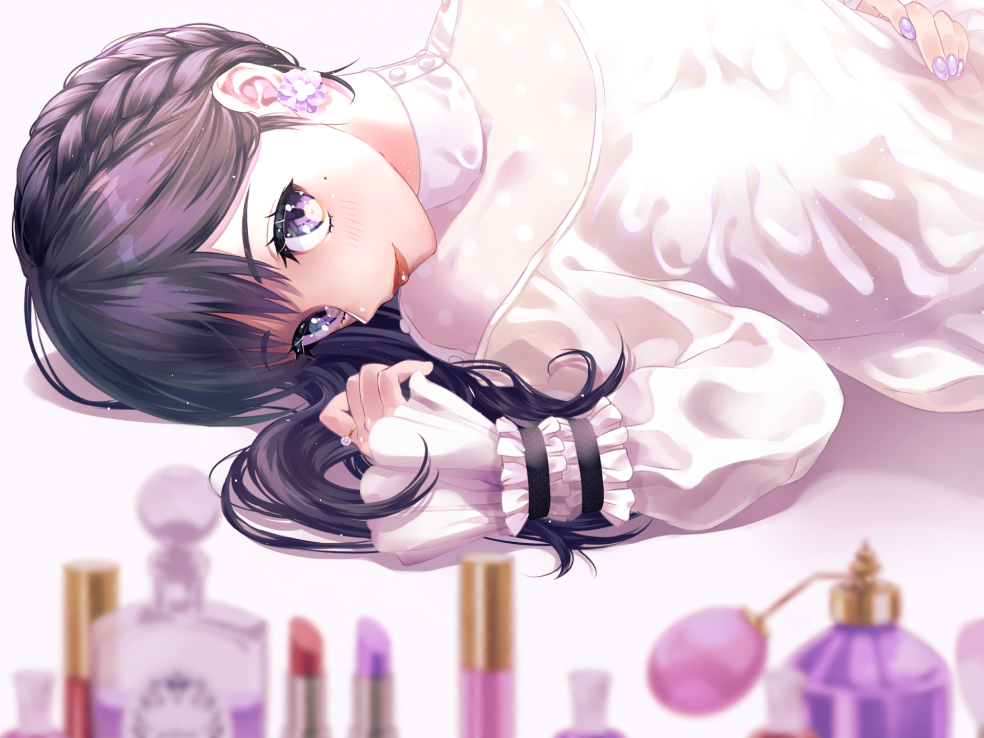 Anime girl with purple eyes, black braided hair, and earrings, smiling while lying down. Lipsticks and perfume bottles are in the foreground. HD desktop wallpaper with bright, detailed artwork.