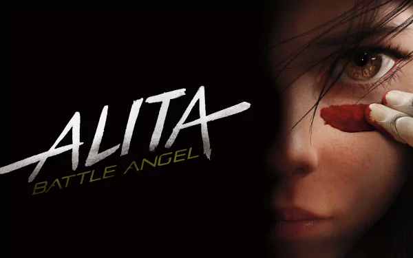 HD desktop wallpaper showing Alita from Alita: Battle Angel, featuring the movie's title in bold text on the left and Alita's face partially visible on the right, with a striking focus on her eye.