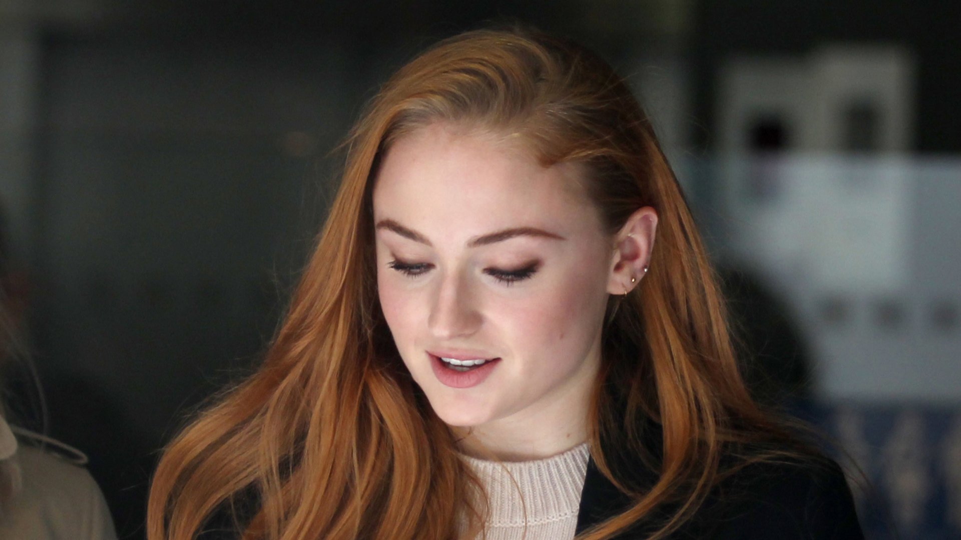 Portrait of English redhead actress Sophie Turner with soft lighting, captured in high-resolution 4K Ultra HD for a PC desktop wallpaper.