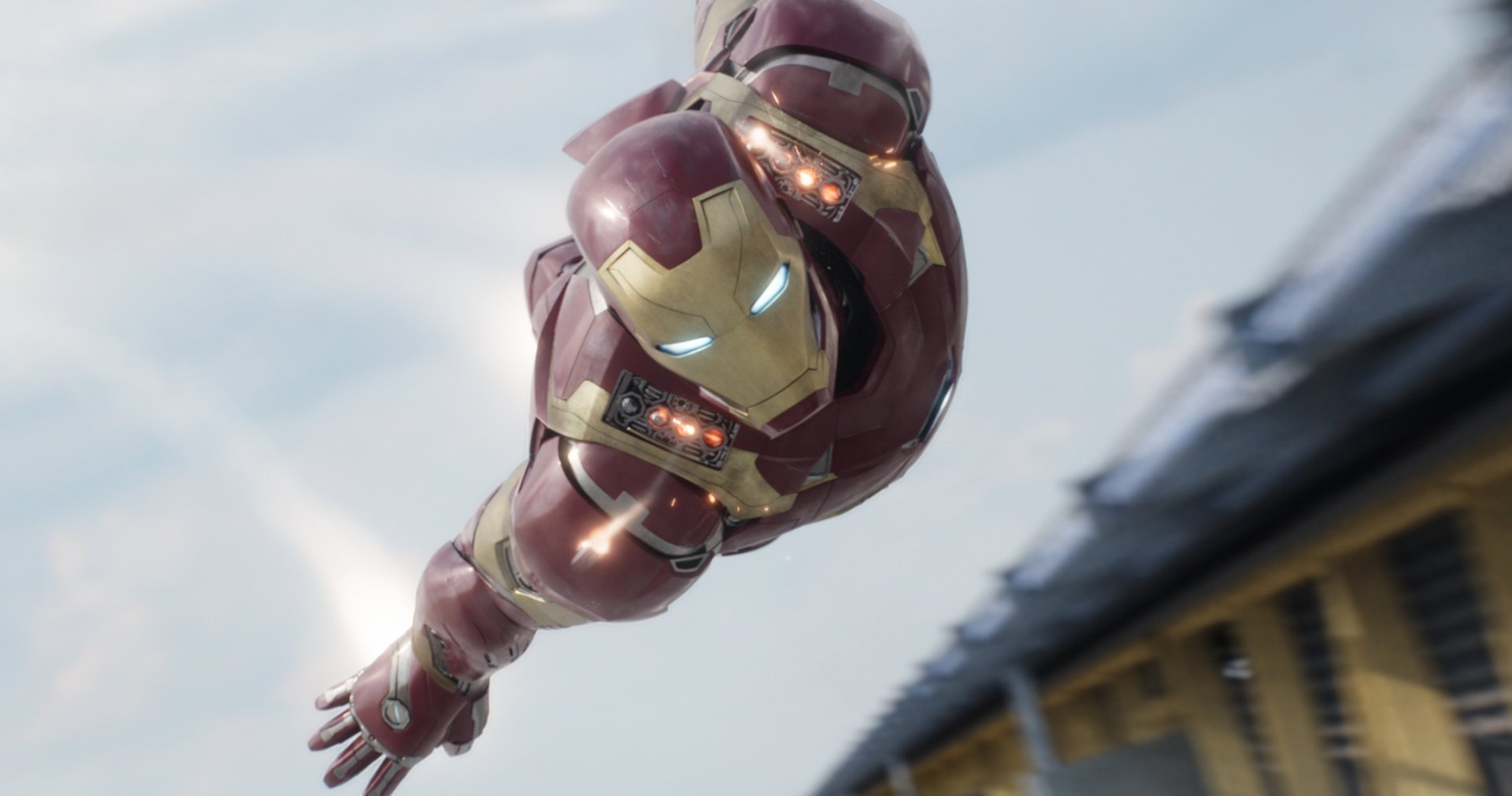 Iron Man in his suit flying dynamically against a blurred background, featured in an HD PC desktop wallpaper from the movie Captain America: Civil War.