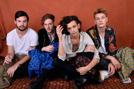 HD desktop wallpaper featuring the band The 1975 posing together, suitable as a background.